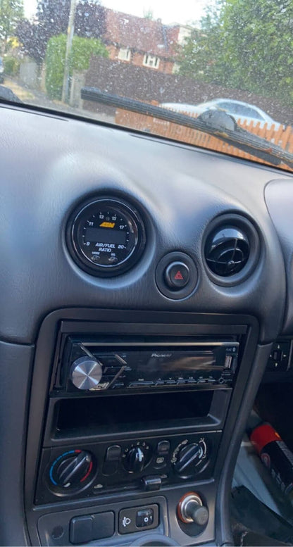 MX5 AEM Wideband Gauge Vent Mount — Fits AEM Wideband O2 controller into the "eye ball" air vent inlets in 2002 Mazda MX-5 NBFL. It is compatible with all MX-5s from 1990 to 2004, as far as I know these models had the same vent holes.