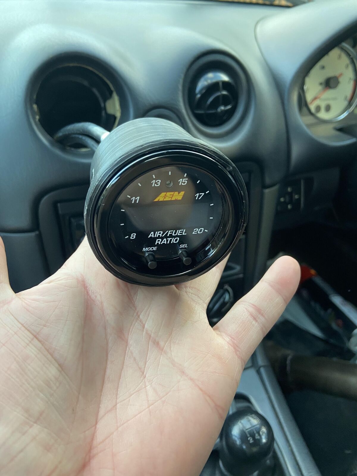 MX5 AEM Wideband Gauge Vent Mount — Fits AEM Wideband O2 controller into the "eye ball" air vent inlets in 2002 Mazda MX-5 NBFL. It is compatible with all MX-5s from 1990 to 2004, as far as I know these models had the same vent holes.