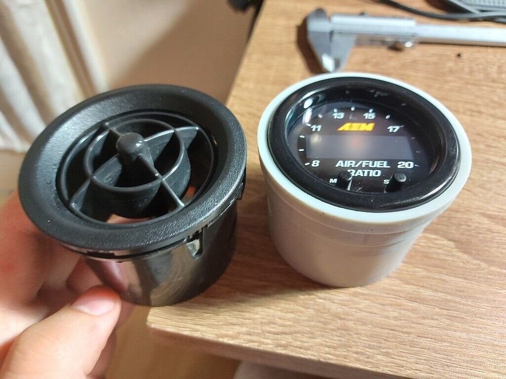 MX5 AEM Wideband Gauge Vent Mount — Fits AEM Wideband O2 controller into the "eye ball" air vent inlets in 2002 Mazda MX-5 NBFL. It is compatible with all MX-5s from 1990 to 2004, as far as I know these models had the same vent holes.