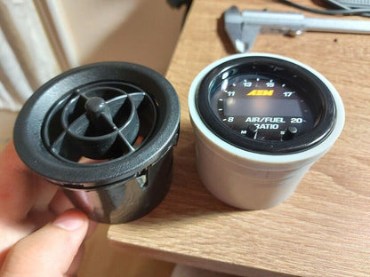 MX5 AEM Wideband Gauge Vent Mount — Fits AEM Wideband O2 controller into the "eye ball" air vent inlets in 2002 Mazda MX-5 NBFL. It is compatible with all MX-5s from 1990 to 2004, as far as I know these models had the same vent holes.
