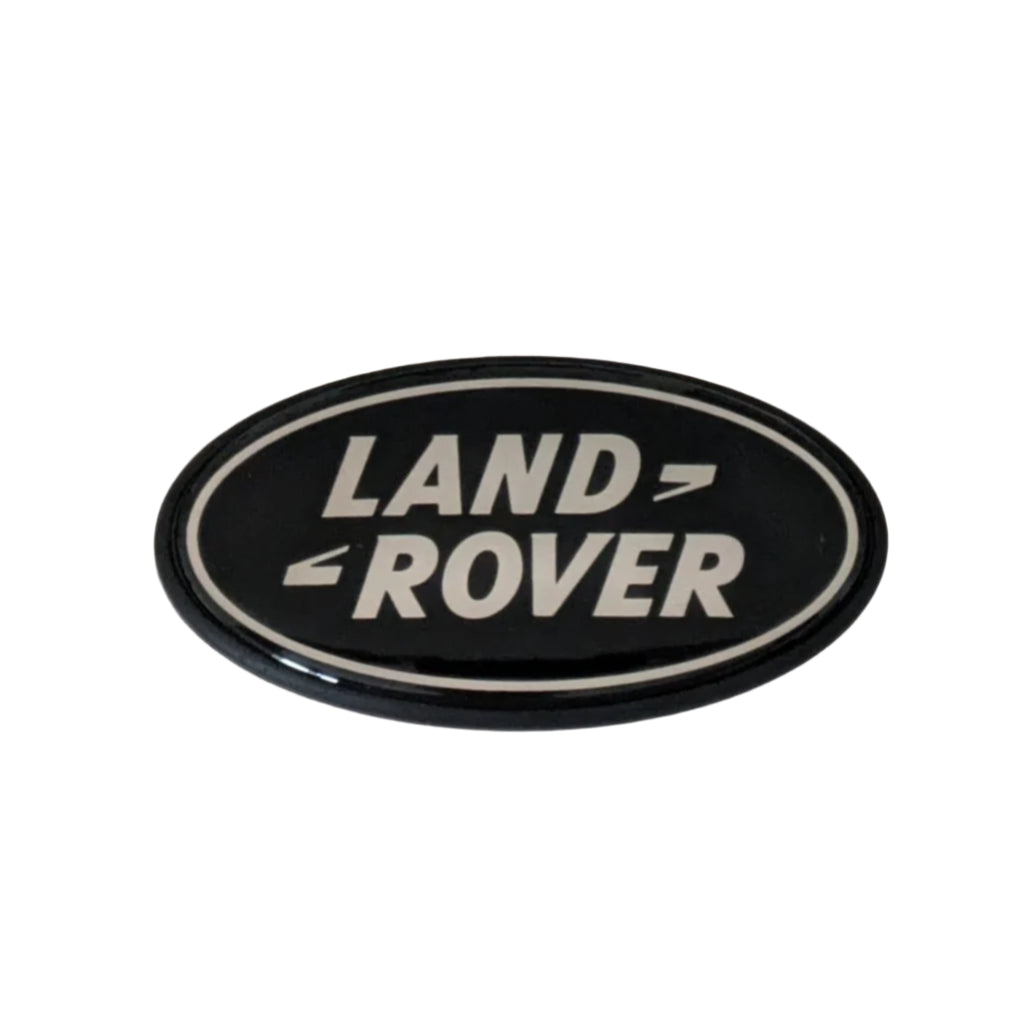 Range Rover Classic Grille Badge Plinth & BADGE — Rear Tailgate / Silver & Black — Enhance your Range Rover Classic's authentic style with this high-quality badge plinth and badge set. Whether you're restoring a classic or adding a personal touch, this is the perfect finishing detail.