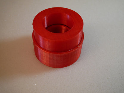 Grease packing tool for Land Rover Defender wheel bearings — This tool helps you push grease quick and clean into the wheel bearings of the Land Rover Defender in the rear. You put the bearing like shown in to the cup. Than you put some grease in it, put the pusher in the correct orientation (as you can also see in the pictures) in it and push. Take the bearing out (some slaps on the back required) and check if it has enough grease.