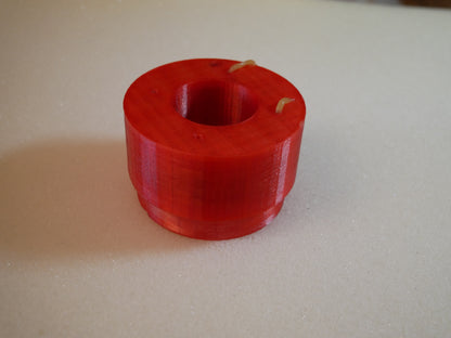Grease packing tool for Land Rover Defender wheel bearings — This tool helps you push grease quick and clean into the wheel bearings of the Land Rover Defender in the rear. You put the bearing like shown in to the cup. Than you put some grease in it, put the pusher in the correct orientation (as you can also see in the pictures) in it and push. Take the bearing out (some slaps on the back required) and check if it has enough grease.