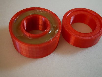 Grease packing tool for Land Rover Defender wheel bearings — This tool helps you push grease quick and clean into the wheel bearings of the Land Rover Defender in the rear. You put the bearing like shown in to the cup. Than you put some grease in it, put the pusher in the correct orientation (as you can also see in the pictures) in it and push. Take the bearing out (some slaps on the back required) and check if it has enough grease.