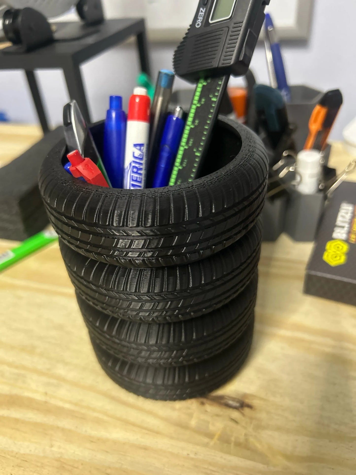 Mud Tire Pen Holder – Offroad Bogger Tire Pen Cup, Flat Bottom Pencil Organizer — Mud tire style for your desk or garage. This offroad bogger tire pen cup keeps pens and pencils in one place while adding a bold wheel-inspired look to any workspace. Loose pens rolling around the bench or cluttering a drawer? A flat-bottom tire pen holder gives you a steady spot that stays put and looks right at home in an office or garage setup. Offroad bogger tire pen holder cup Flat bottom pencil organizer design Compact…